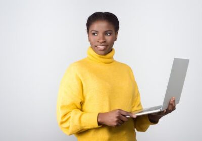 beautiful-smiling-african-american-woman-holding-laptop_74855-4711