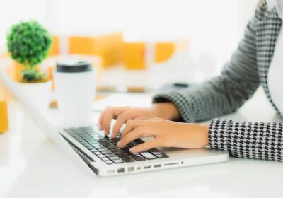 portrait-beautiful-young-asian-business-woman-work-from-home-with-laptop-mobile-phone-with-cardboard-box-ready-shipping_74190-10336