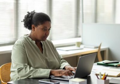 side-view-woman-working-laptop_23-2149831297-1