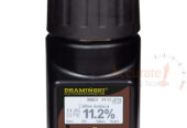 Dramniski grain moisture meters with a jug in store Kampala