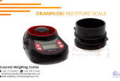 Dramniski grain moisture meters with a jug in store Kampala